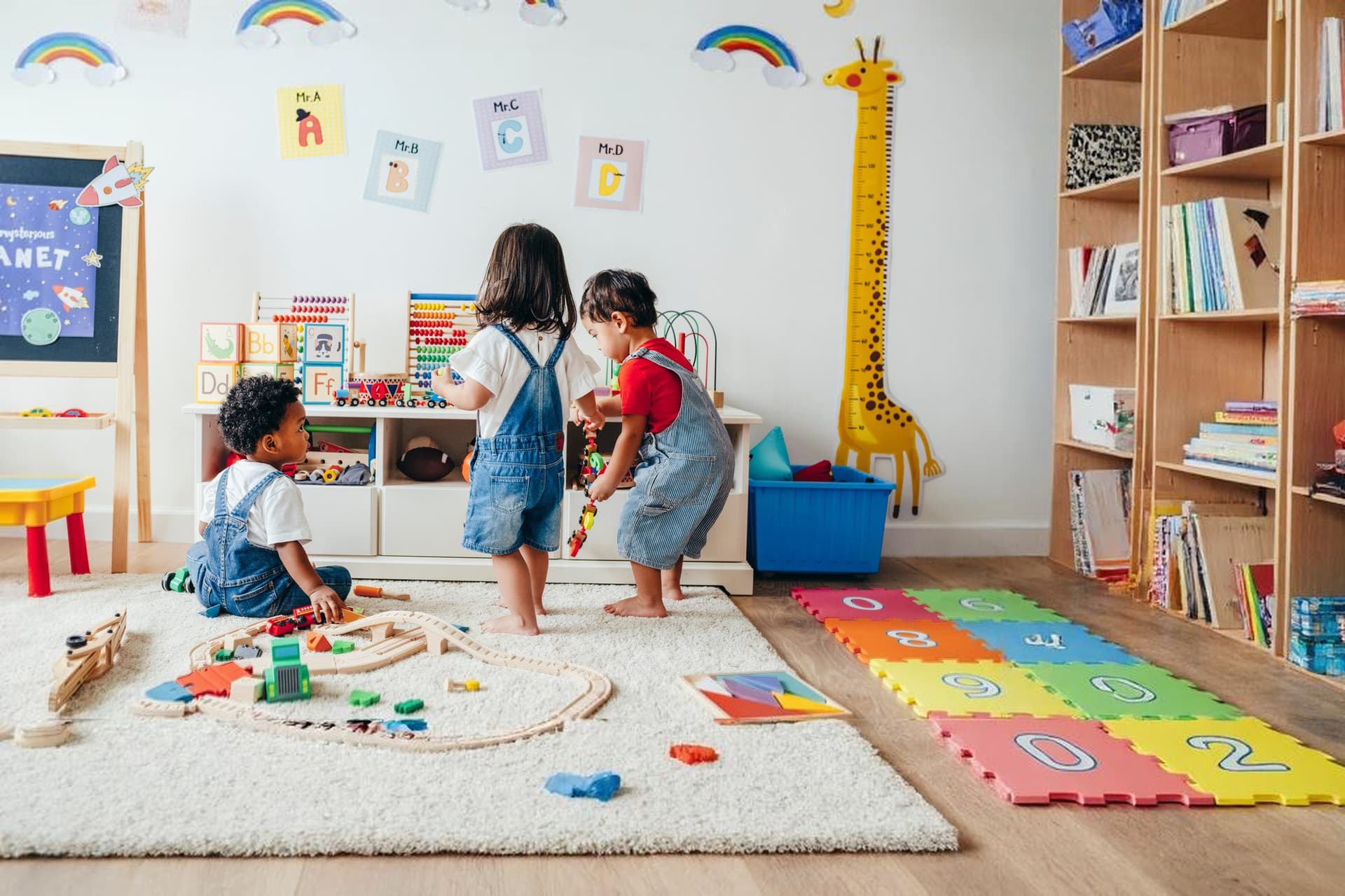 Toddlers playing in a colorful Kids Discovery classroom