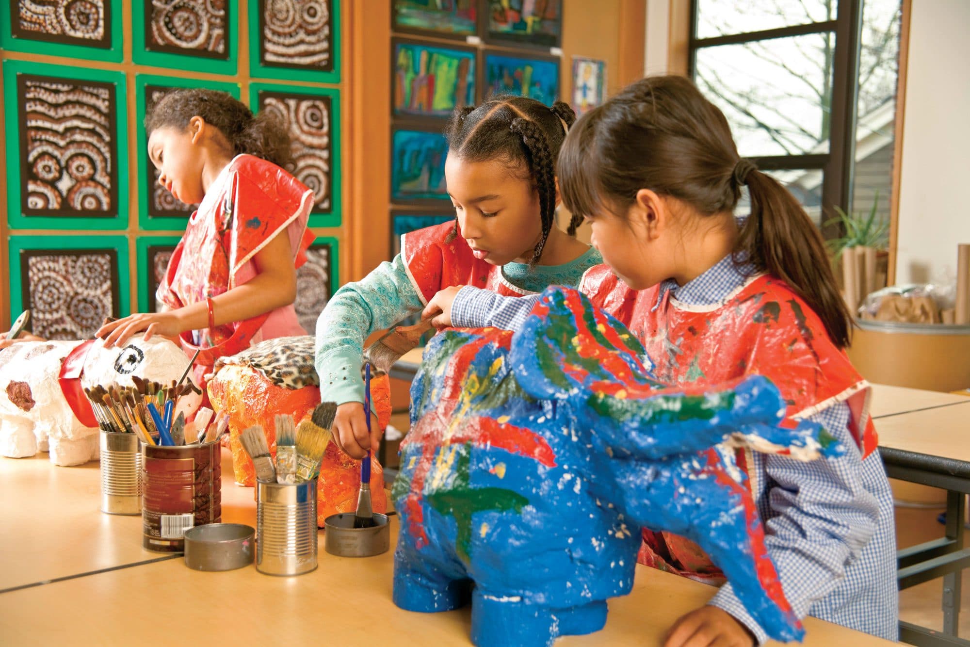 Children working on an art project at Kids Discovery